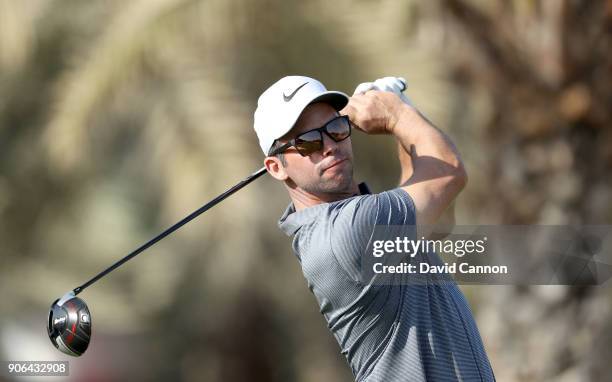 Paul Casey of England plays his tee shot on the par 4, 14th hole during the first round of the 2018 Abu Dhabi HSBC Golf Championship at the Abu Dhabi...