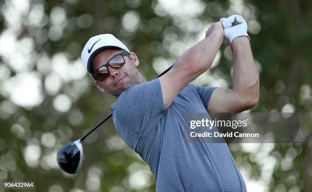 Paul Casey of England plays his tee shot on the par 4, 17th hole during the first round of the 2018 Abu Dhabi HSBC Golf Championship at the Abu Dhabi...