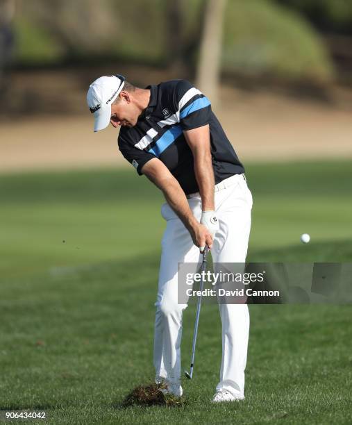 Robert Karlsson of Sweden plays his second shot on the par 4, 16th hole during the first round of the 2018 Abu Dhabi HSBC Golf Championship at the...