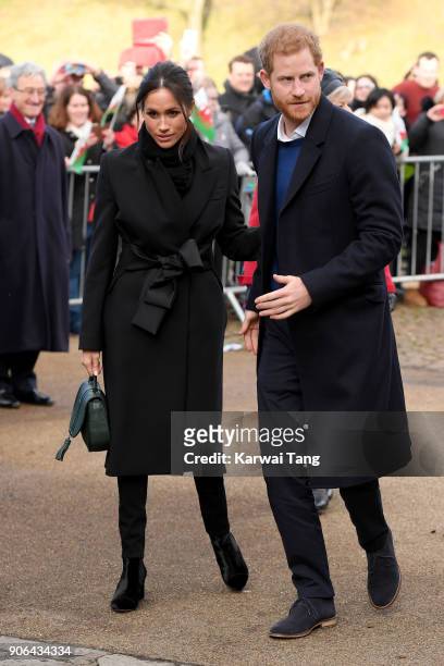 Prince Harry and his fiancee Meghan Markle arrive at a walkabout at Cardiff Castle on January 18, 2018 in Cardiff, Wales.