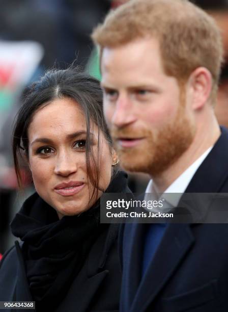 Prince Harry and his fiancee Meghan Markle are seen during a walkabout at Cardiff Castle on January 18, 2018 in Cardiff, Wales.