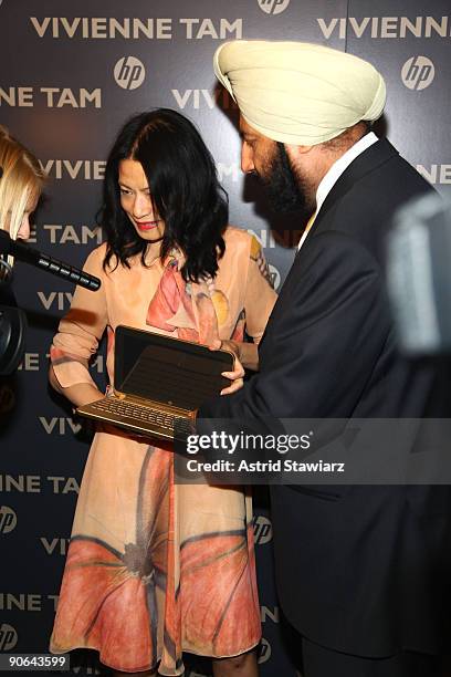 Designer Vivienne Tam and Hewlett-Packard Sr. VP of Global Marketing, Satjiv Chahil attend the Digital Clutch Design reveal by HP and Vivienne Tam at...