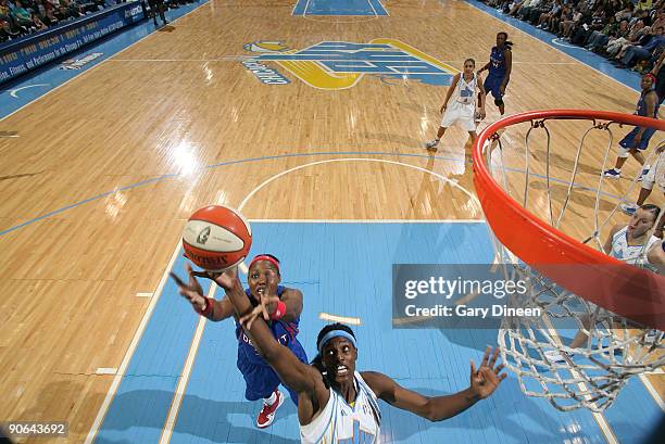 Sylvia Fowles of the Chicago Sky grabs for the rebound against Cheryl Ford of the Detroit Shock during the WNBA game on September 12, 2009 at the UIC...