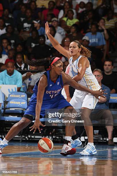 Kara Braxton of the Detroit Shock drives past Mistie Bass of the Chicago Sky during the WNBA game on September 12, 2009 at the UIC Pavilion in...