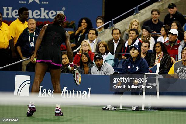 Serena Williams argues with a line judge during her Women's Singles Semifinal match against Kim Clijsters of Belgium on day thirteen of the 2009 U.S....