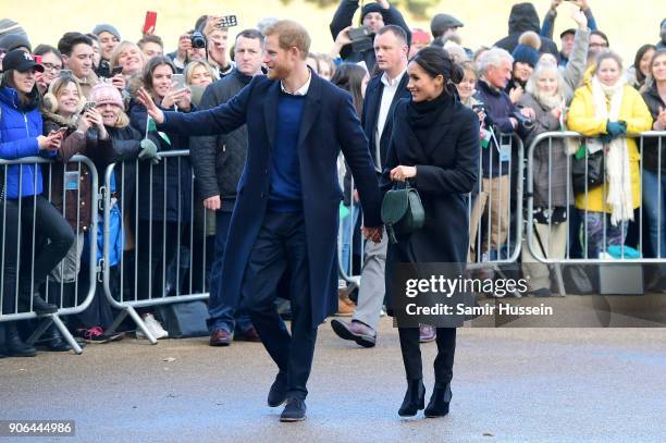 Prince Harry and his fiancee Meghan Markle are seen during a walkabout at Cardiff Castle on January 18, 2018 in Cardiff, Wales.