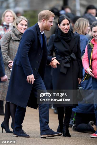 Prince Harry and his fiancee Meghan Markle are seen during a walkabout at Cardiff Castle on January 18, 2018 in Cardiff, Wales.