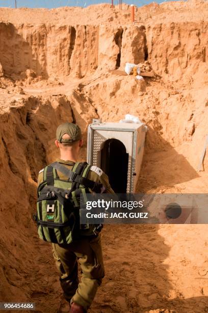 Picture taken on January 18, 2018 from the Israeli side of the border with the Gaza Strip shows a Israeli army officer walking near the entrance of a...