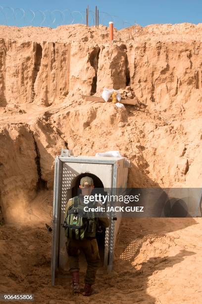 Picture taken on January 18, 2018 from the Israeli side of the border with the Gaza Strip shows a Israeli army officer walking near the entrance of a...