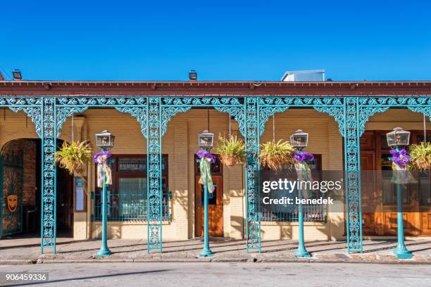 ornate traditional porch in downtown pensacola florida during mardi gras - pensacola florida stock pictures, royalty-free photos & images