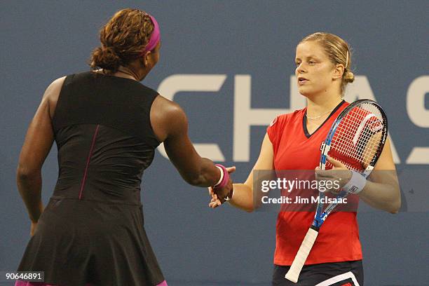 Kim Clijsters of Belgium was congratulated by Serena Williams after Williams was disqualified for a conduct violation towards a line judge during the...