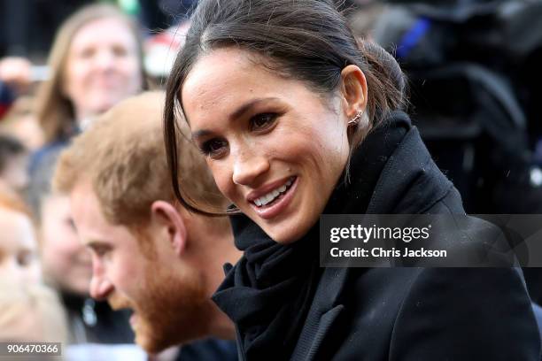 Prince Harry and his fiancee Meghan Markle are seen during a walkabout at Cardiff Castle on January 18, 2018 in Cardiff, Wales.