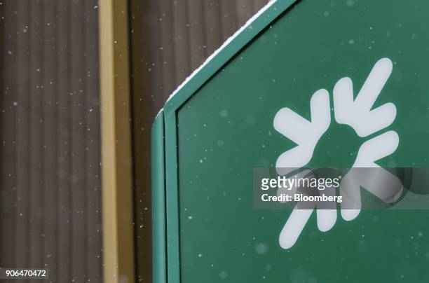 Snow sits on top of a logo displayed outside a Citizens Financial Group Inc. Bank branch in downtown Portsmouth, Ohio, U.S., on Tuesday, Jan. 18,...