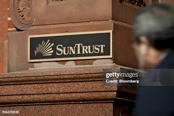 Signage is displayed outside a SunTrust Banks Inc. Branch in Washington, D.C., U.S., on Thursday, Jan. 11, 2018. SunTrust Banks Inc. Is scheduled to...