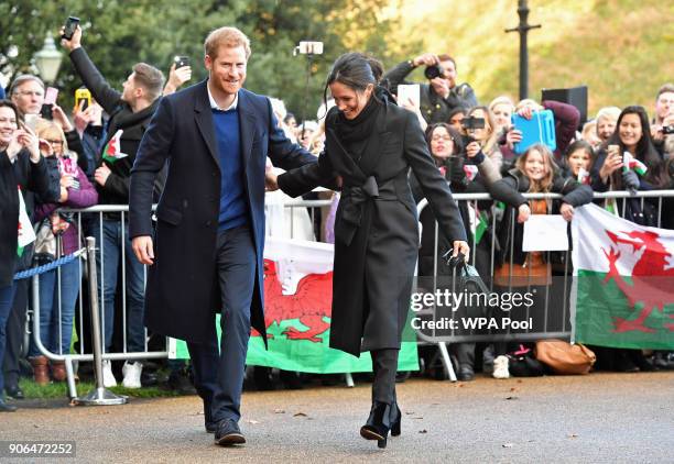 Prince Harry and his fiancee Meghan Markle arrive for their visit to Cardiff Castle on January 18, 2018 in Cardiff, Wales.