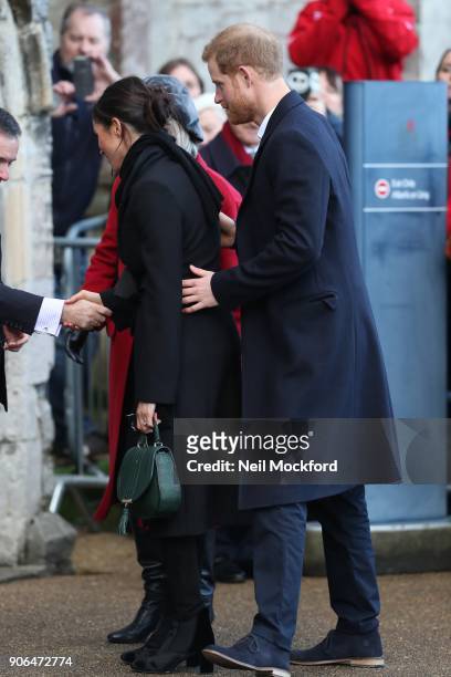Prince Harry and fiance Meghan Markle during a walkabout at Cardiff Castle on January 18, 2018 in Cardiff, Wales.