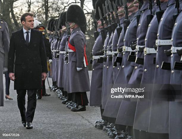 Prime Minister Theresa May and French President Emmanuel Macron view a guard of honour ahead of UK-France summit talks at the Royal Military Academy...