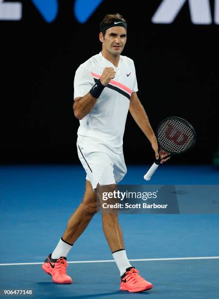 Roger Federer of Switzerland celebrates match point and winning his second round match against Jan-Lennard Struff of Germany on day four of the 2018...
