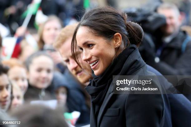 Prince Harry and his fiancee Meghan Markle are seen during a walkabout at Cardiff Castle on January 18, 2018 in Cardiff, Wales.