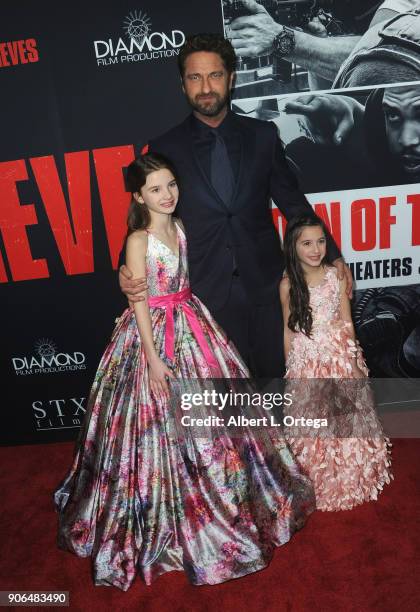 Elle Whitfield, Gerard Butler and Madelyn Lazar arrive for the Premiere Of STX Films' "Den Of Thieves" held at Regal LA Live Stadium 14 on January...