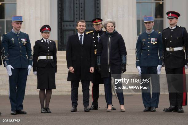 Prime Minister Theresa May and French President Emmanuel Macron join English and French service personnel ahead of UK-France summit talks at the...