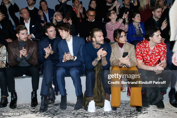 Kevin Trapp, Antoine Arnault, his brother Alexandre Arnault, David Beckham, Victoria Beckham and their son Brooklyn Beckham attend the Louis Vuitton...