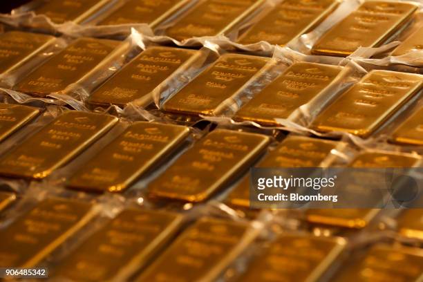 One kilogram bars of gold sit on a table at the Sharps Pixley Ltd. Showroom in this arranged photograph in London, U.K., on Thursday, Jan. 18, 2018....