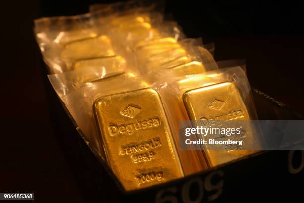 One kilogram bars of gold sit on a table at the Sharps Pixley Ltd. Showroom in this arranged photograph in London, U.K., on Thursday, Jan. 18, 2018....