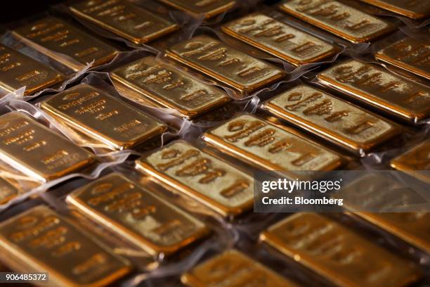 One kilogram bars of gold sit on a table at the Sharps Pixley Ltd. Showroom in this arranged photograph in London, U.K., on Thursday, Jan. 18, 2018....