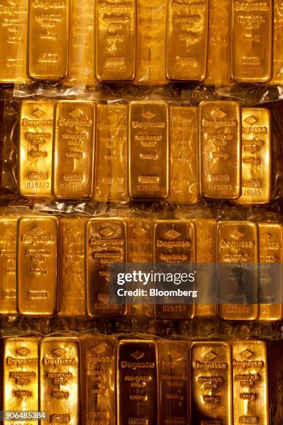 Thirty two, one kilogram bars of gold, worth a total of approximately one million British pounds sit on a table at the Sharps Pixley Ltd. Showroom in...