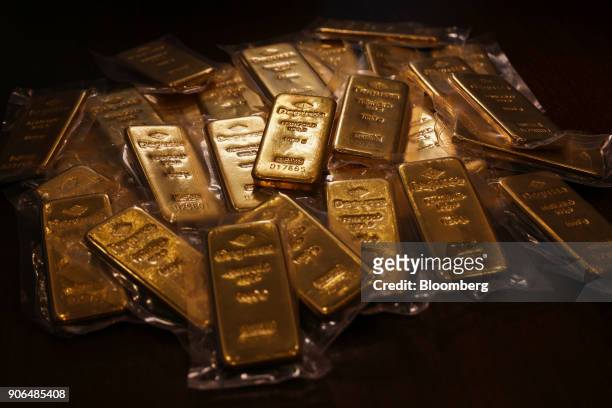Thirty two, one kilogram bars of gold, worth a total of approximately one million British pounds sit on a table at the Sharps Pixley Ltd. Showroom in...