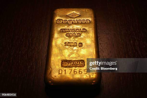 One kilogram bar of gold sits in the Sharps Pixley Ltd. Showroom in this arranged photograph in London, U.K., on Thursday, Jan. 18, 2018. Amid the...