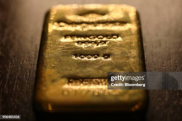 One kilogram bar of gold sits in the Sharps Pixley Ltd. Showroom in this arranged photograph in London, U.K., on Thursday, Jan. 18, 2018. Amid the...