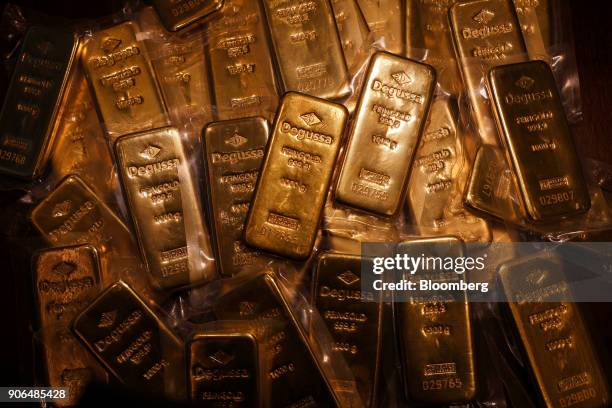 Thirty two, one kilogram bars of gold, worth a total of approximately one million British pounds sit on a table at the Sharps Pixley Ltd. Showroom in...