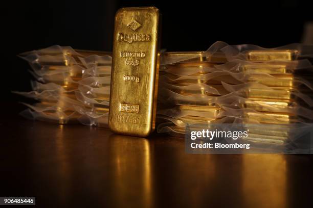 Thirty two, one kilogram bars of gold, worth a total of approximately one million British pounds sit on a table at the Sharps Pixley Ltd. Showroom in...