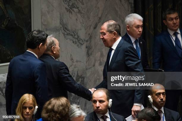 Russia's Foreign Minister Sergei Lavrov confers with Kazakistan's President Nursultan Nazarbayev during a Security Council meeting on...