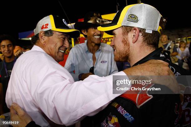 Team owner Felix Sabates left, Former NASCAR Champion Richard Petty center talk with Brian Vickers, driver of the Red Bull Toyota after securing the...