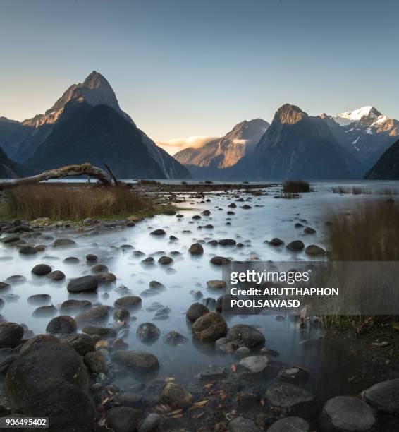 sunset at milford sound , fiordland national park , new zealand - fiordland national park stock pictures, royalty-free photos & images