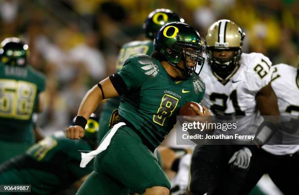 Quarterback Jeremiah Masoli of the Oregon Ducks runs with the ball against the Purdue Boilermakers at Autzen Stadium on September 12, 2009 in Eugene,...