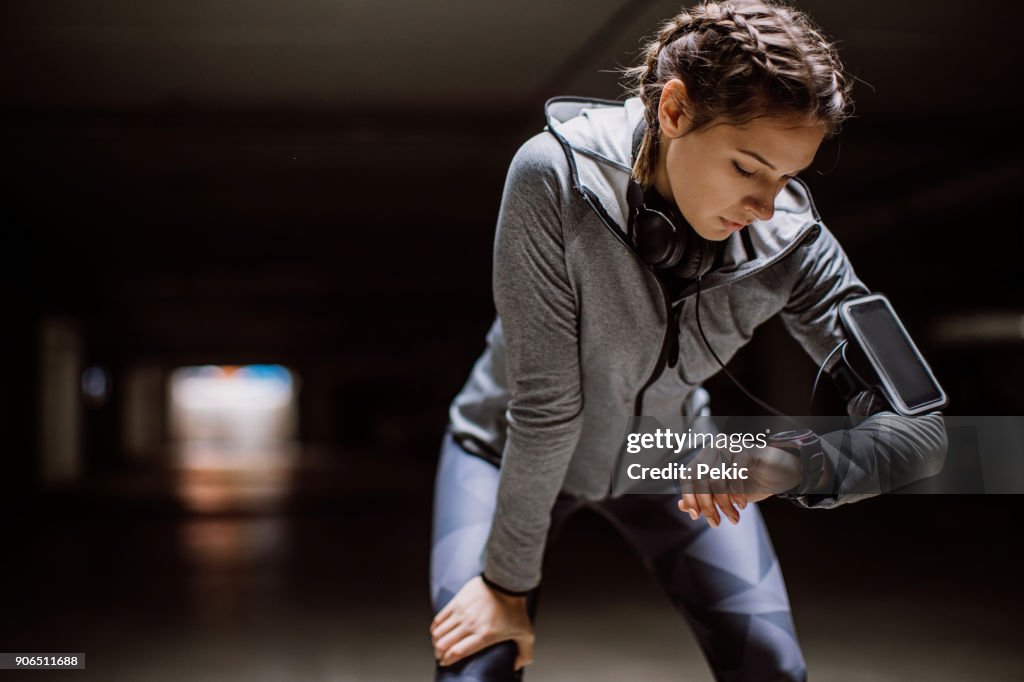 Woman monitoring her progress on smartwatch