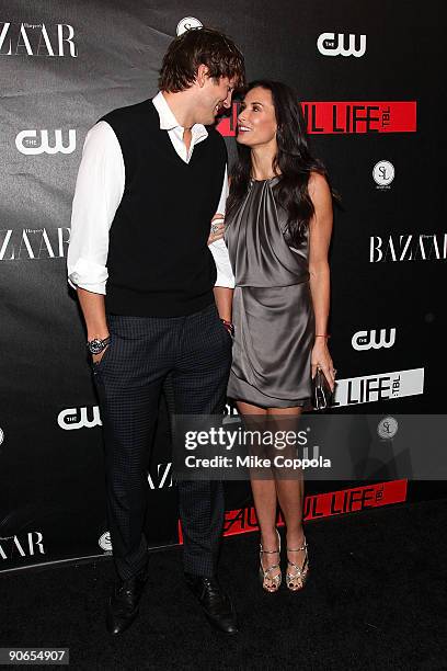 Actors Ashton Kutcher and Demi Moore attendThe CW's "The Beautiful Life: TBL" series premiere at Simyone Lounge on September 12, 2009 in New York...