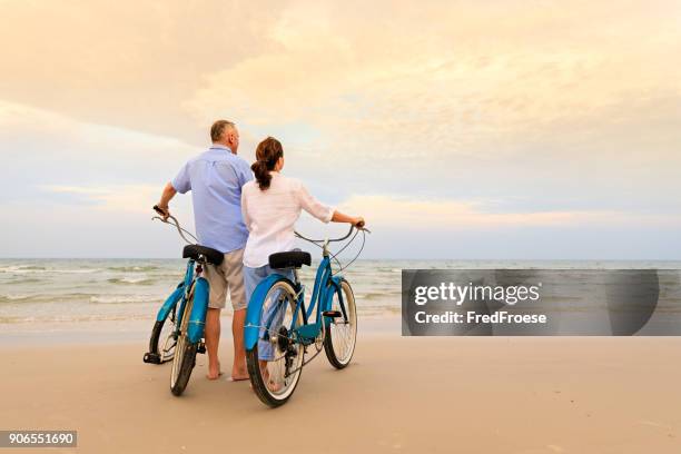 active couple with bikes - asian couple walking stock pictures, royalty-free photos & images