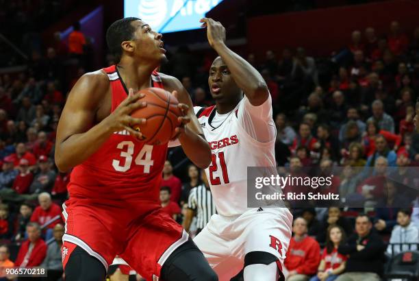 Kaleb Wesson of the Ohio State Buckeyes in action as Mamadou Doucoure of the Rutgers Scarlet Knights defends during a game at the Rutgers Athletic...