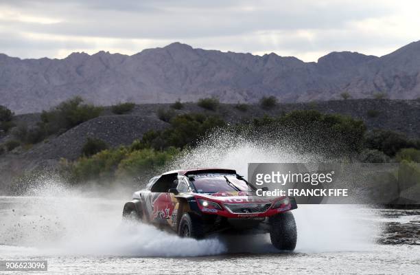 Peugeot's French driver Cyril Despres and co-driver David Castera of France, compete during the Stage 12 of the 2018 Dakar Rally between Chilecito...