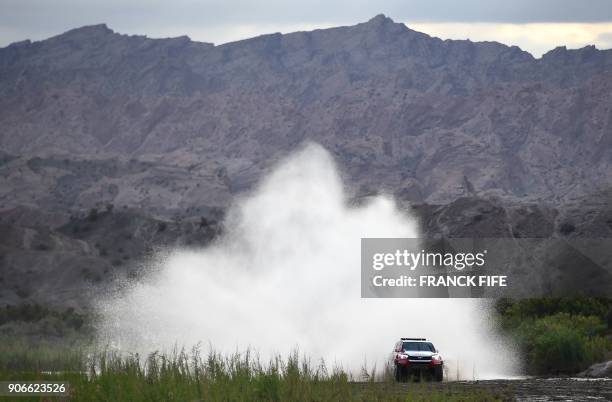 Toyota's driver Giniel De Villiers of South Africa and his co-driver Dirk Von Zitzewitz of Germany, compete during the Stage 12 of the 2018 Dakar...