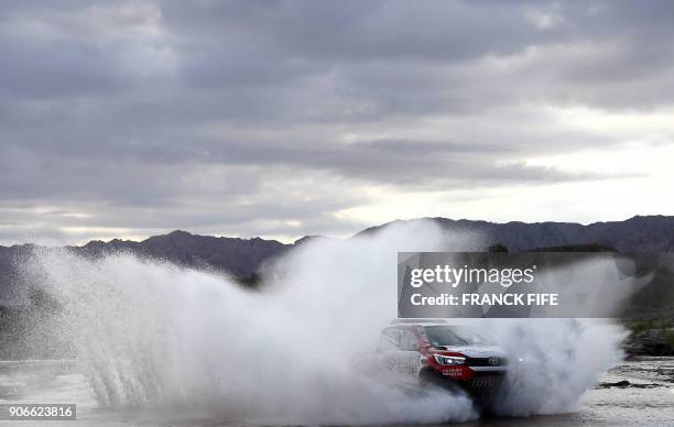 Toyota's driver Giniel De Villiers of South Africa and his co-driver Dirk Von Zitzewitz of Germany, compete during the Stage 12 of the 2018 Dakar...