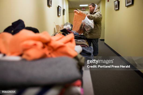 Rick Allen of Biddeford looks for clothing at the 10th annual Martin Luther King Jr. Day of Service at the First Parish Church. The event provides...