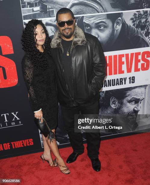 Rapper/actor Ice Cube and wife Kimberly Woodruff arrive for the Premiere Of STX Films' "Den Of Thieves" held at Regal LA Live Stadium 14 on January...