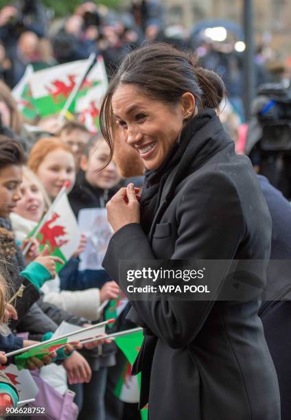 Prince Harry and fiance Meghan Markle during a walkabout at Cardiff Castle on January 18, 2018 in Cardiff, Wales.