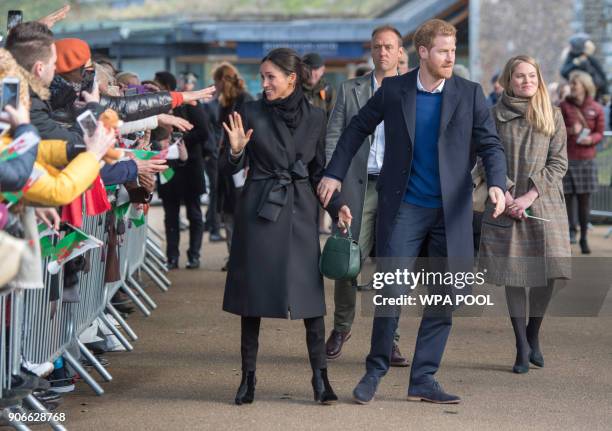 Prince Harry and fiance Meghan Markle during a walkabout at Cardiff Castle on January 18, 2018 in Cardiff, Wales.